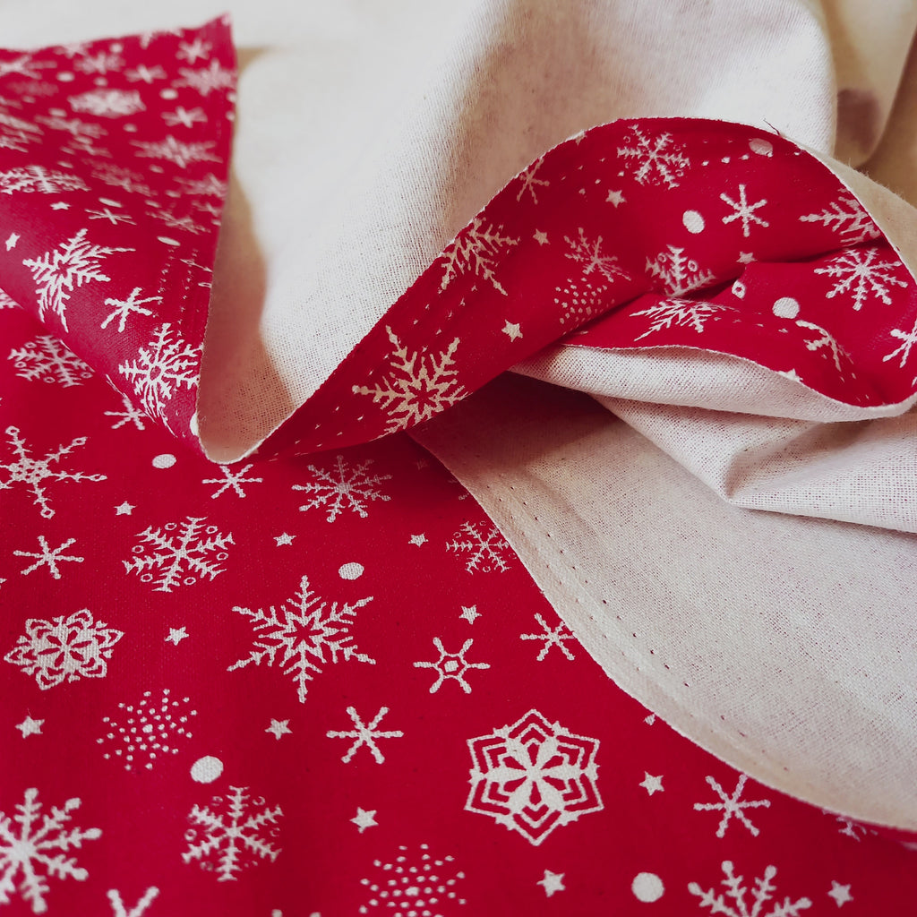 Festive Red Cotton Fabric Scattered with  Cream Snowflakes