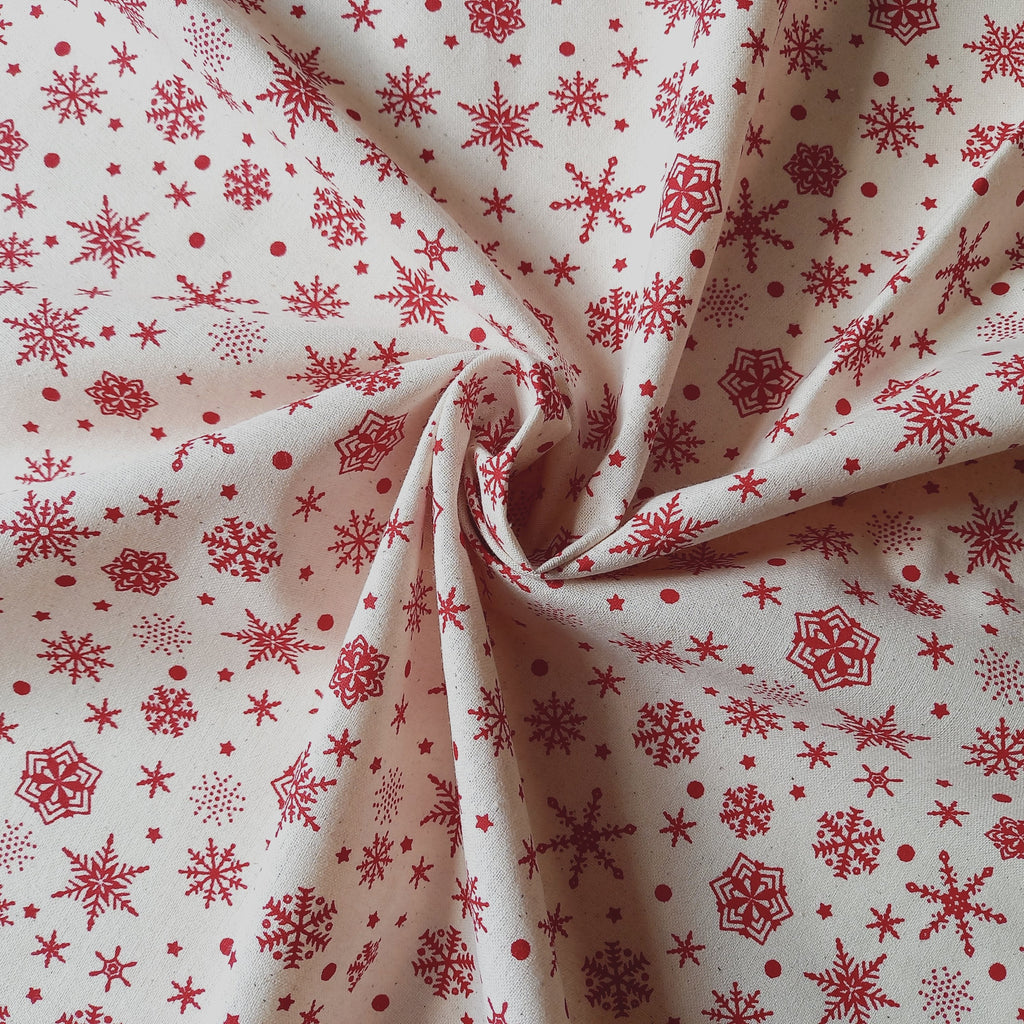 Red Snowflakes on Calico Fabric