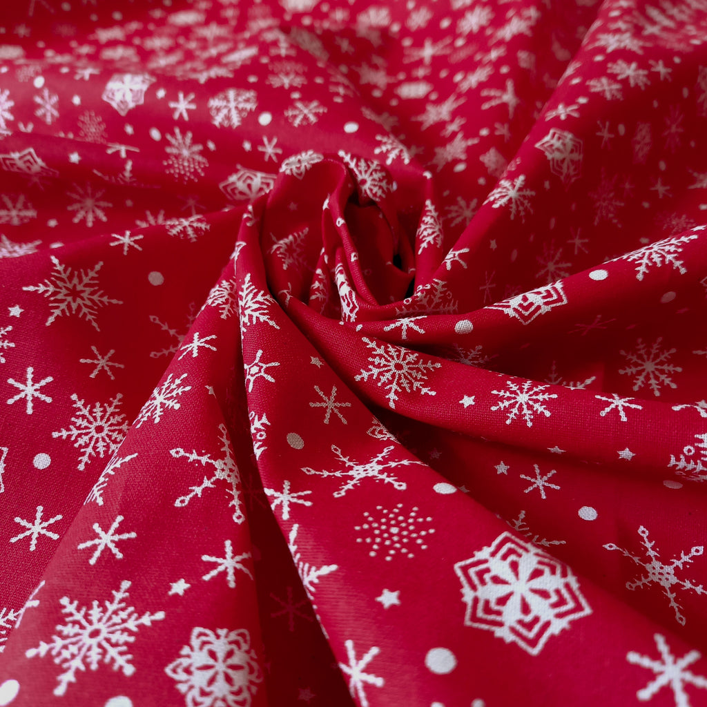 Festive Red Cotton Fabric Scattered with  Cream Snowflakes